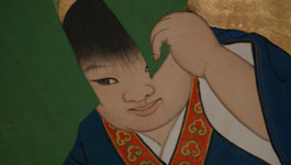 葉の間から顔をのぞかせる青い着物を着た子供のイラスト